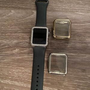 Black Smartwatch with Gold and Silver Cases